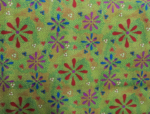 Australian Indigenous Aboriginal Dot Painting depicting flowers coloured red blue magenta white on a iridescent green background surrounded with tiny dots of green red  in the desert designed by Lauren Doolan