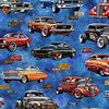 red orange black green with flame sides Hot Rods on a motley blue cotton fabric background