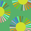 Colour wheel in shades of orange green blue brown pink with a yellow centre on a green background 53262d-4
