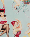 Ladies in Red, Yellow, Pink and Polka dots 8571C Mint colour background riding bikes wearing scarves