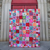 Garden of flowers on a quilt in a rainbow of colours