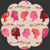 Silhouette heads with flowers in colours of pink, salmon, burgundy , Apricot and flowers around the crown of the head, in the shape of a flower