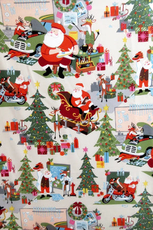 Christmas scene depicting santa in his workshop garage with his reindeer working on cars bikes sleighs surrounded with tools gingerbread men coffee snacks presents calendars Christmas trees in colours of green red white pink yellow blue brown white  8954A