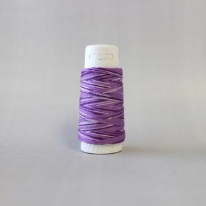 thread on cone for use with Sashiko stitching in a variegated coloured in shades of purple and cream LC89.403